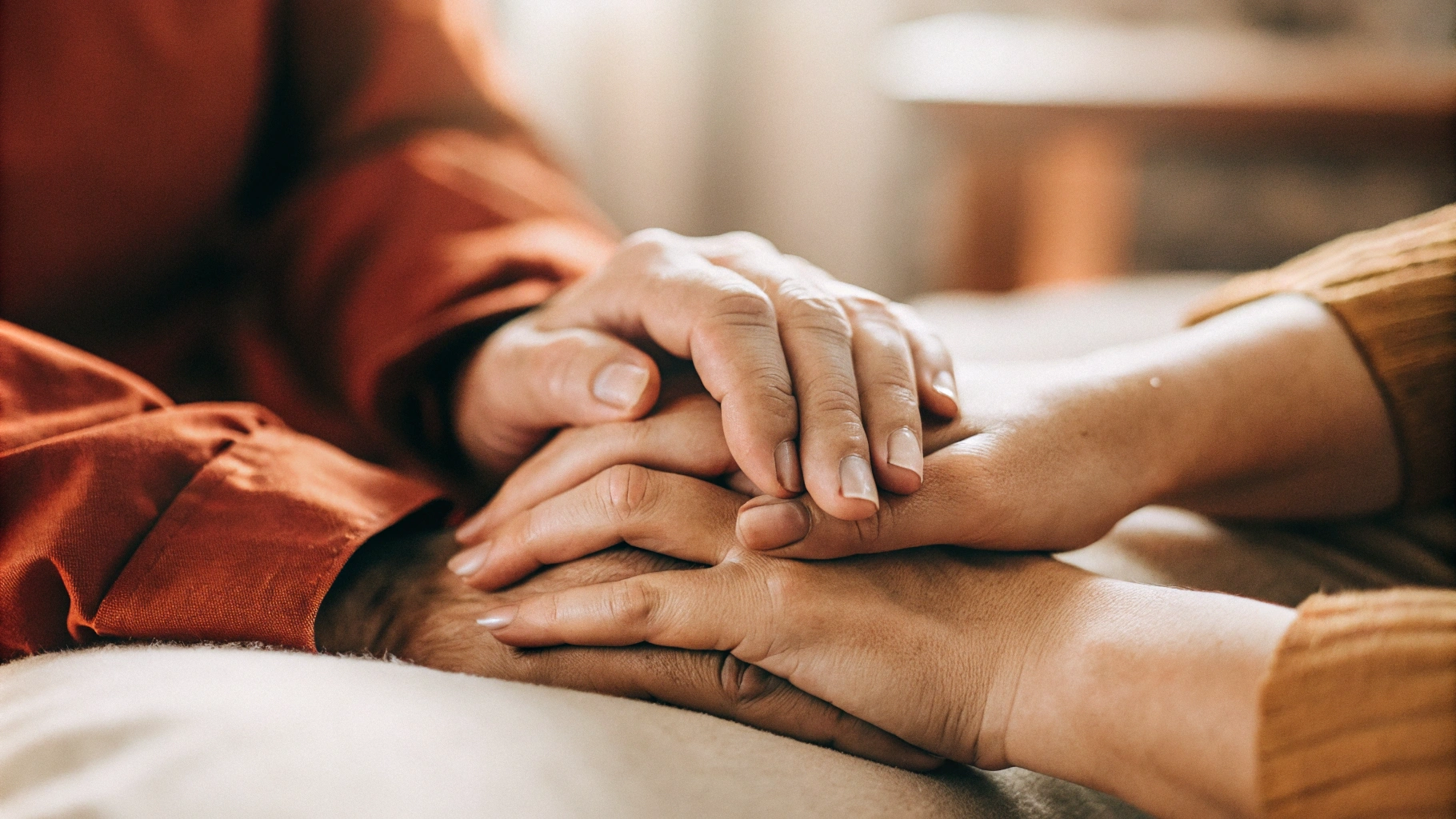 a-close-up-shot-of-two-hands-gently-holding-each-other